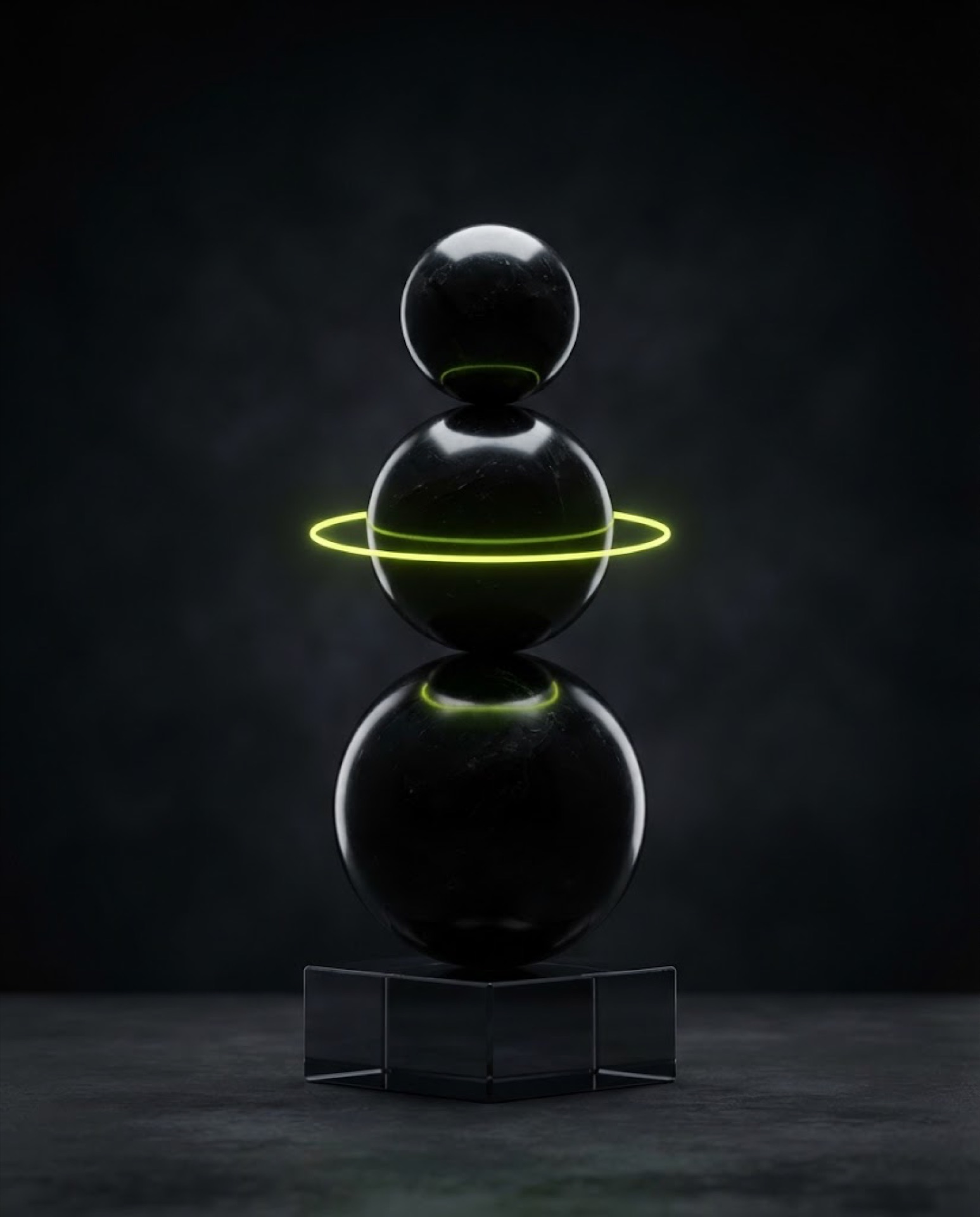 Stack of polished black obsidian spheres with a lime ring of light